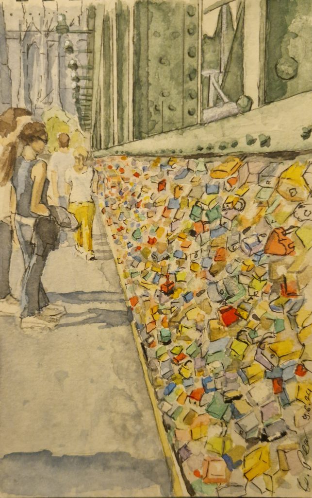 Ein Aquarell auf Büttenpapier mit dem Titel Köln Hohenzollernbrücke, entstanden im Atelier Perc Kunst Minden. Das Bild im Format 15 cm x 25 cm zeigt die berühmte Brücke in Köln mit detailreicher Darstellung des Rheins und der Stadtkulisse.